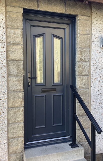 Grey uPVC door with white frame