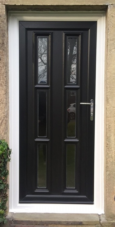 Black uPVC door with white frame fitted
