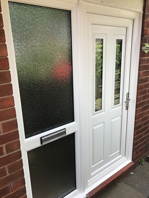 White uPVC door and glazed side panel