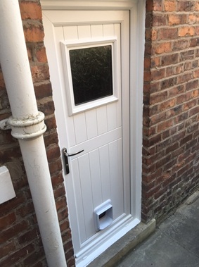 uPVC door in white with catflap